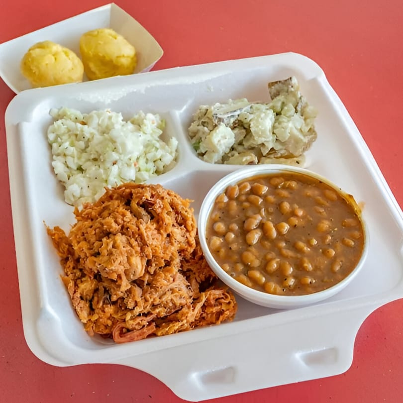 Lakeside Barbeque & Subs pulled pork platter with coleslaw, potato salad, baked beans, and corn muffins.